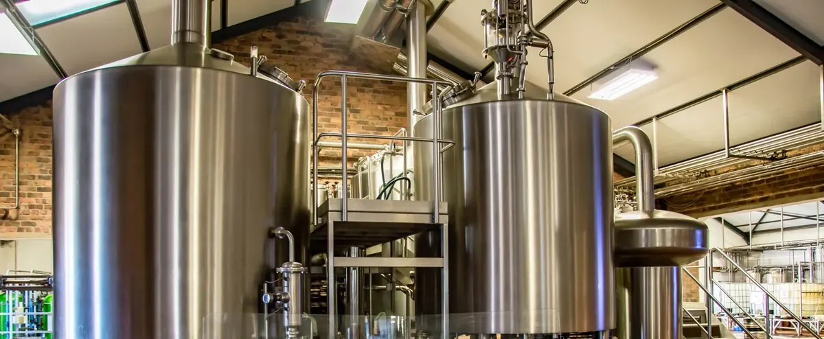 Stainless steel brewhouse tanks in a craft brewery