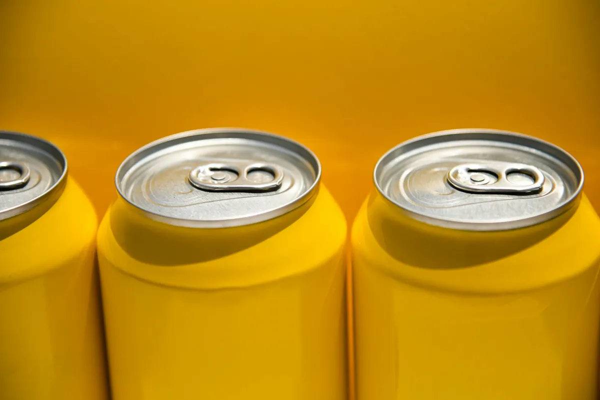 Row of plain yellow beer cans