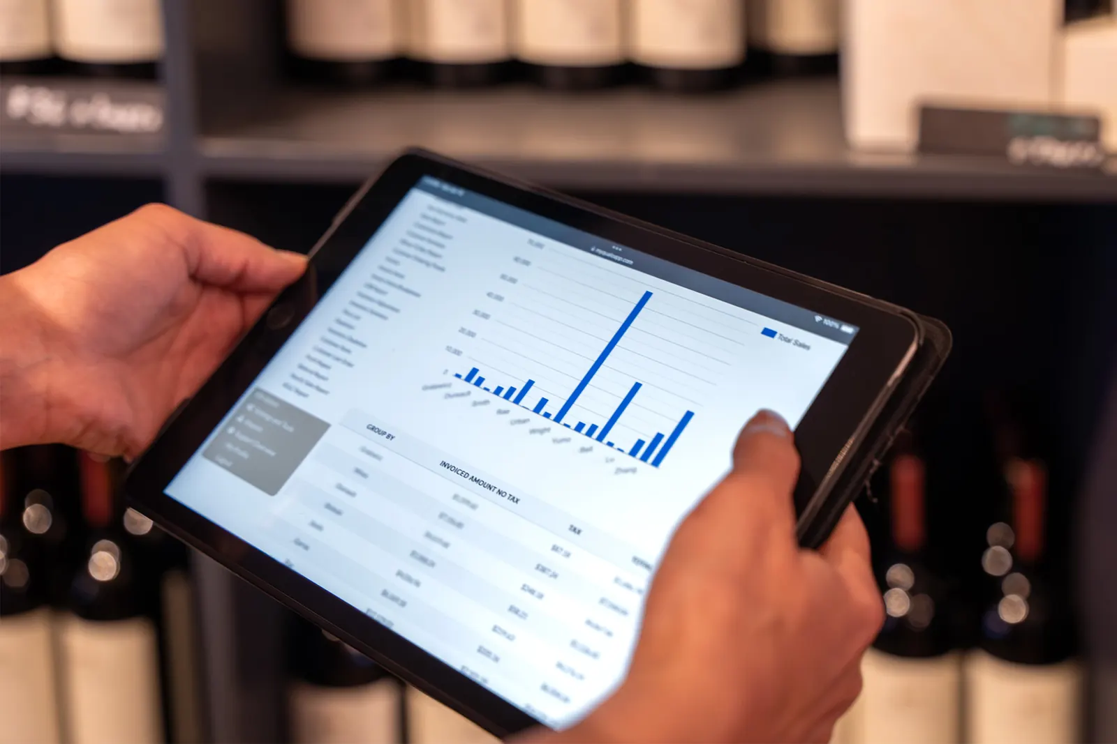 Tablet showing an inventory report in a wine shop