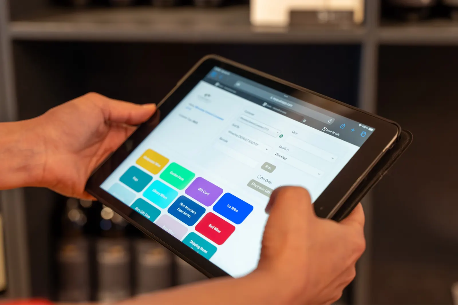 Staff member taking a payment on a tablet POS